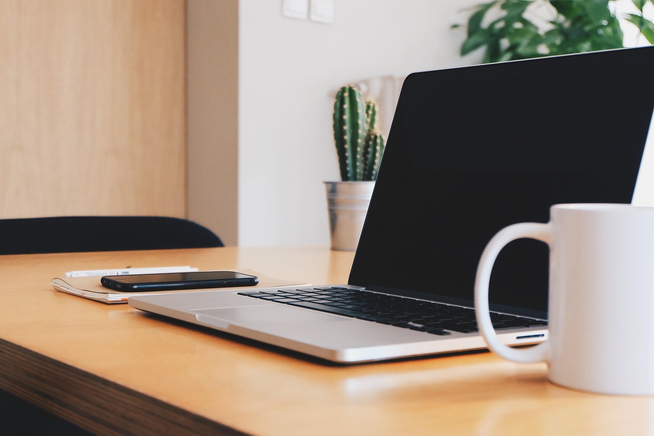 Modern business workspace with laptop and office desk